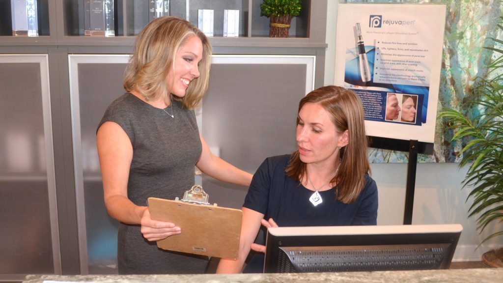 Dr. Meredith Lassiter and Yana at the Ageless Remedies reception desk