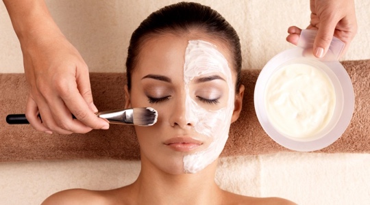 Woman receiving a relaxing facial treatment